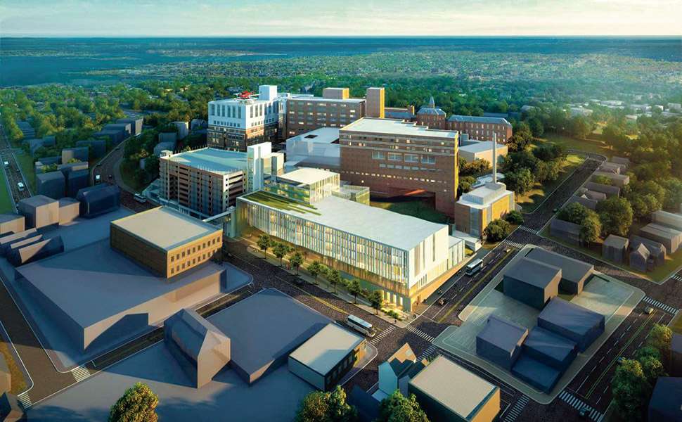 An aerial rendering of several hospital buildings including a modern six-story glass one