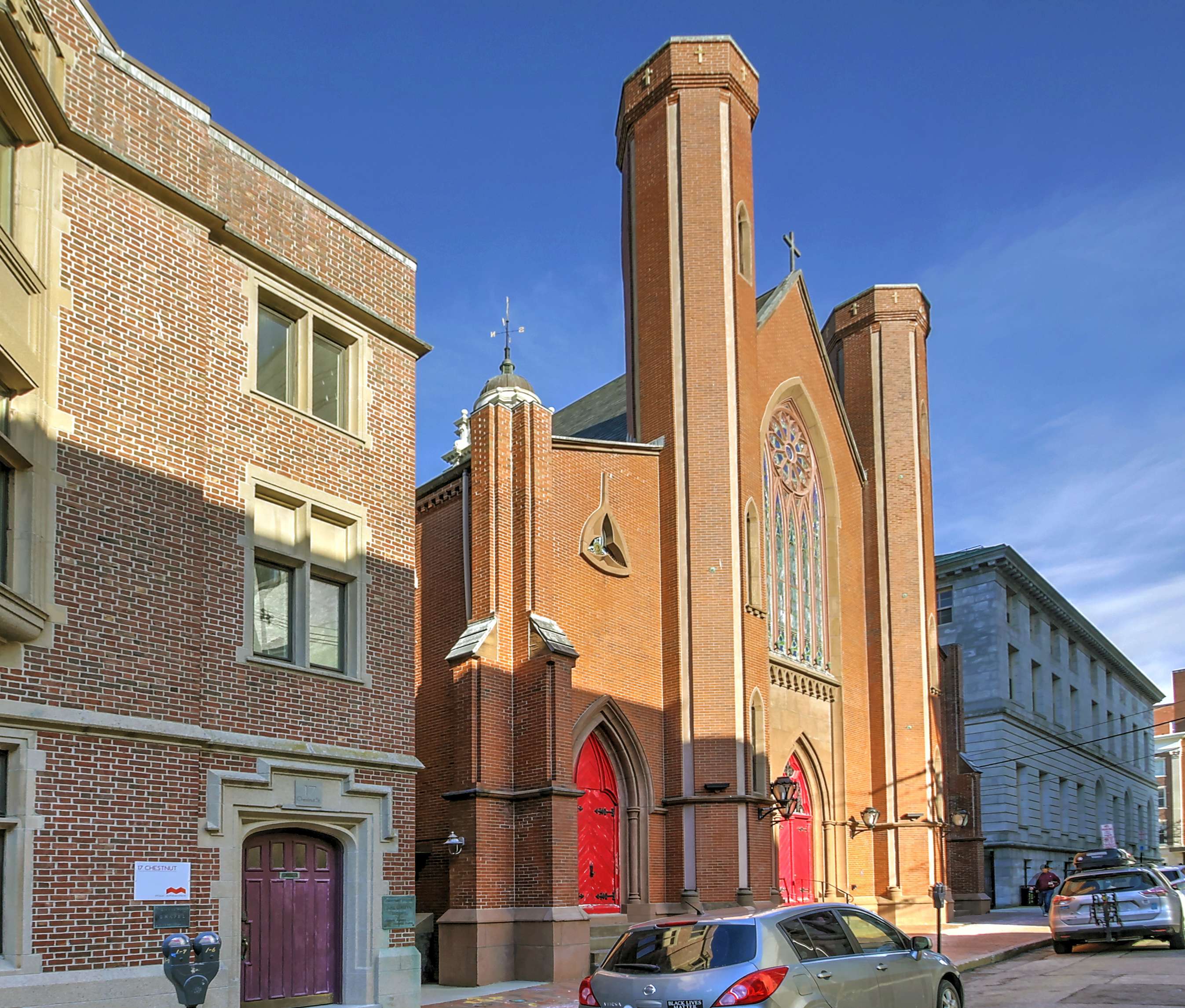 brick church with red doors