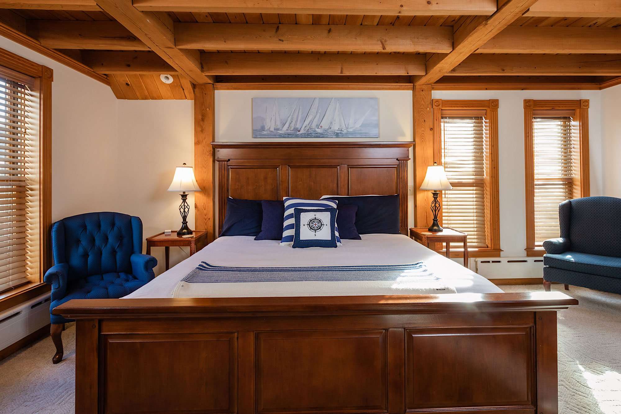 bed and wood coffered ceiling