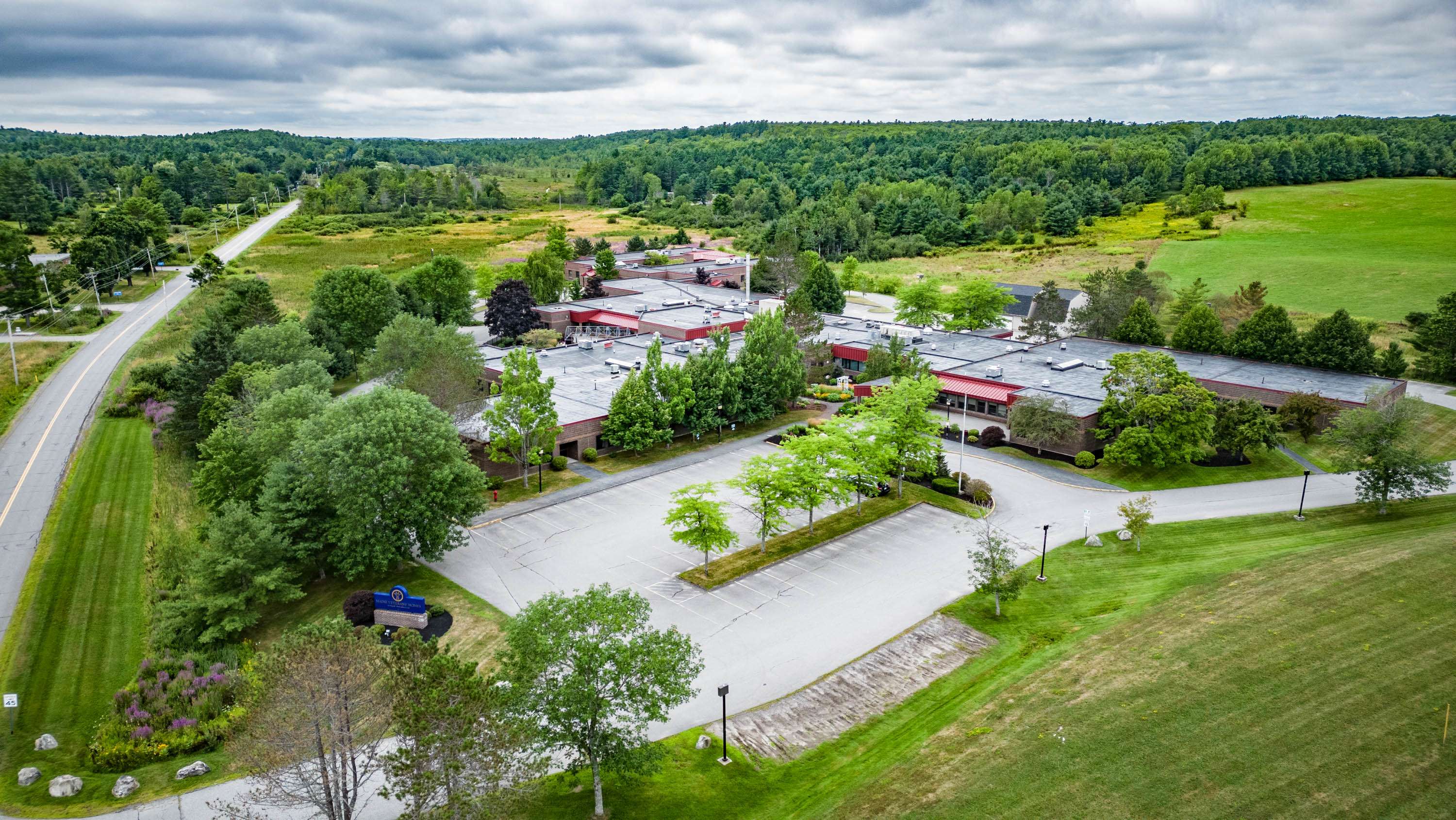 aerial of building and fields