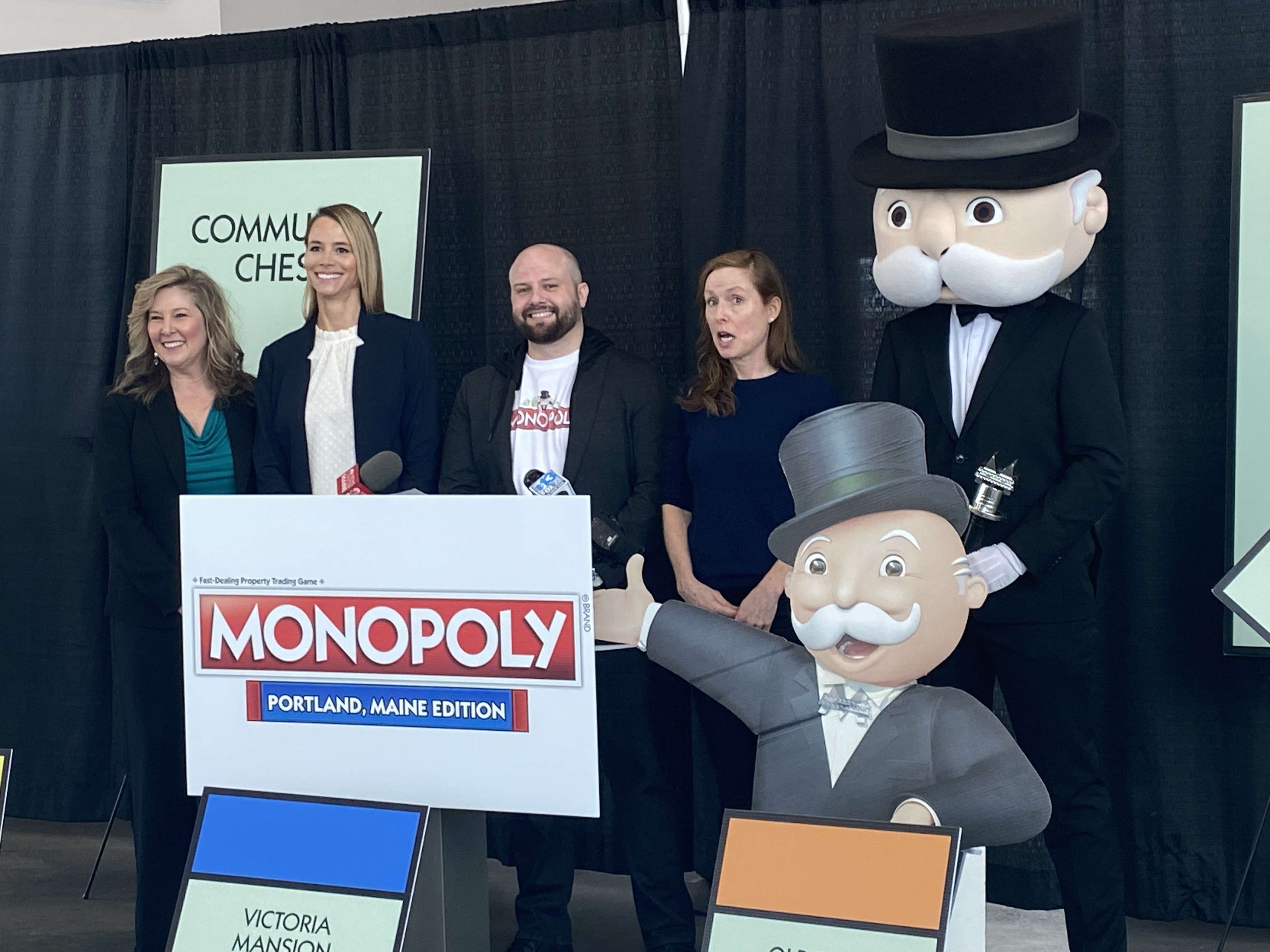 Quincy Hentzel, Kate Snyder and others with Mr Monopoly