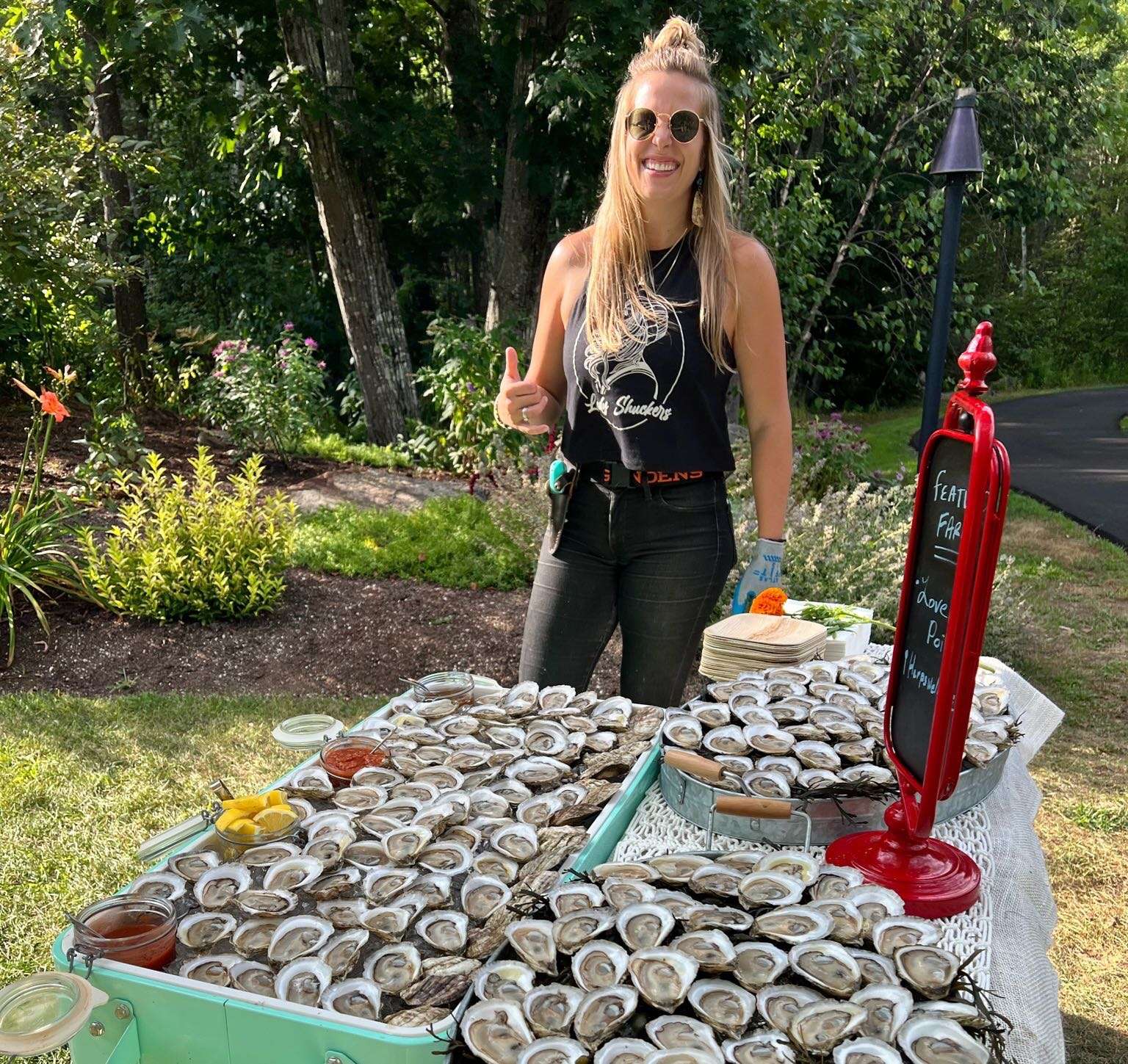 person with bins of oysters