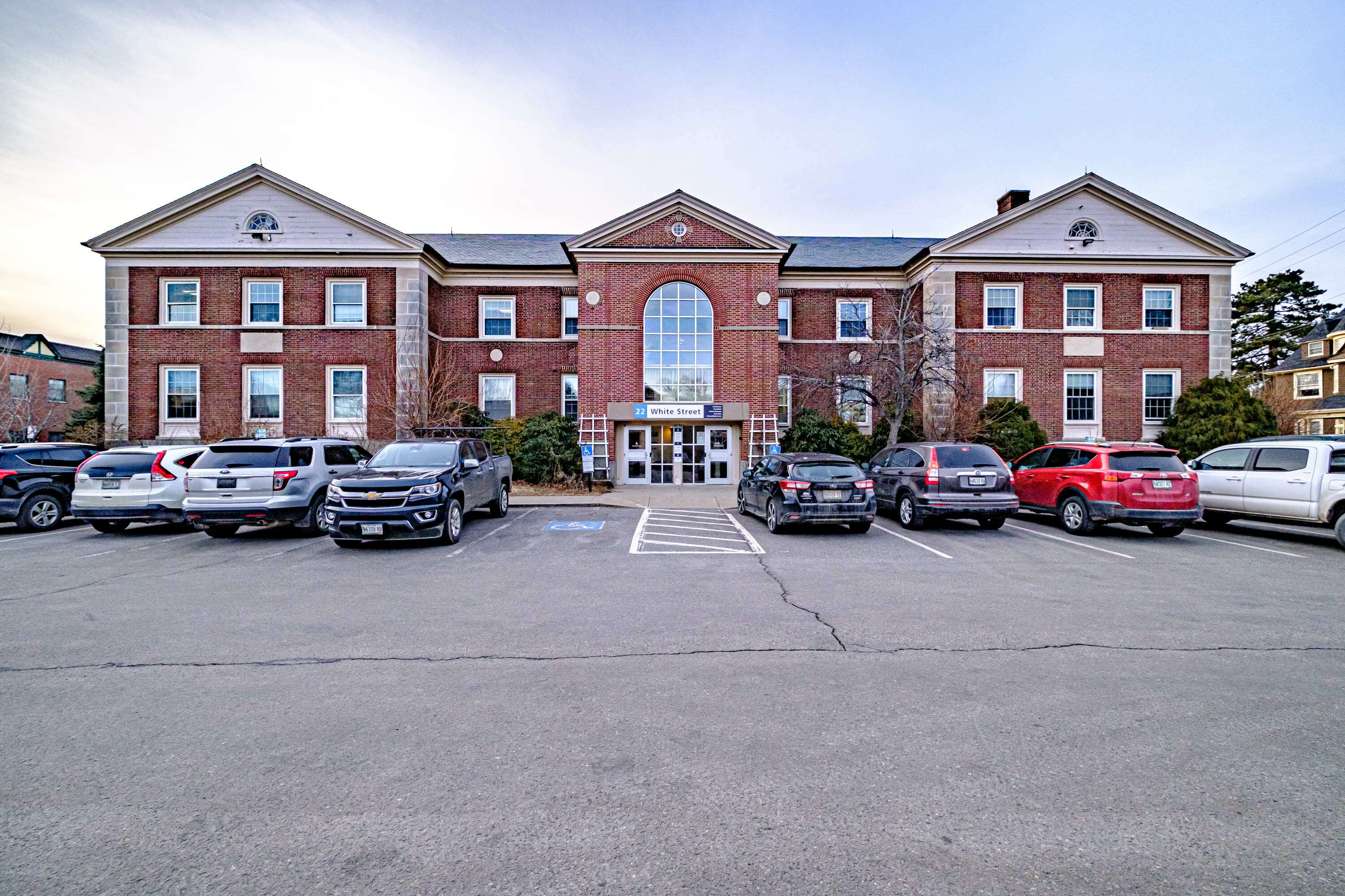 brick building and parking lot