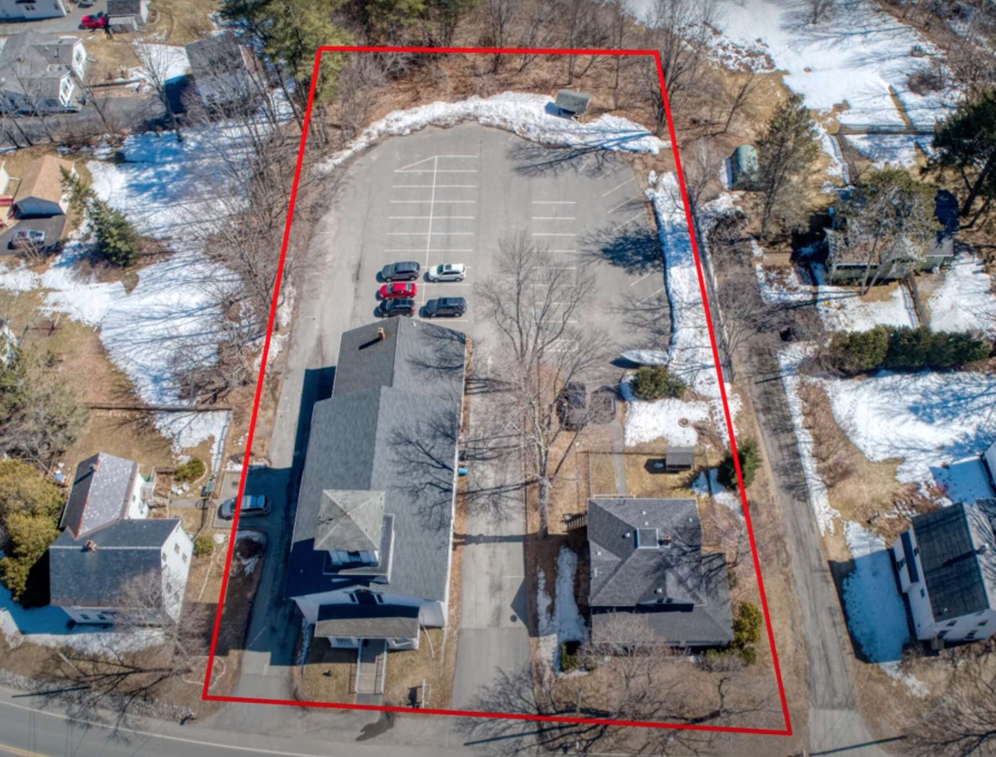 2 buildings and parking lot with red outline