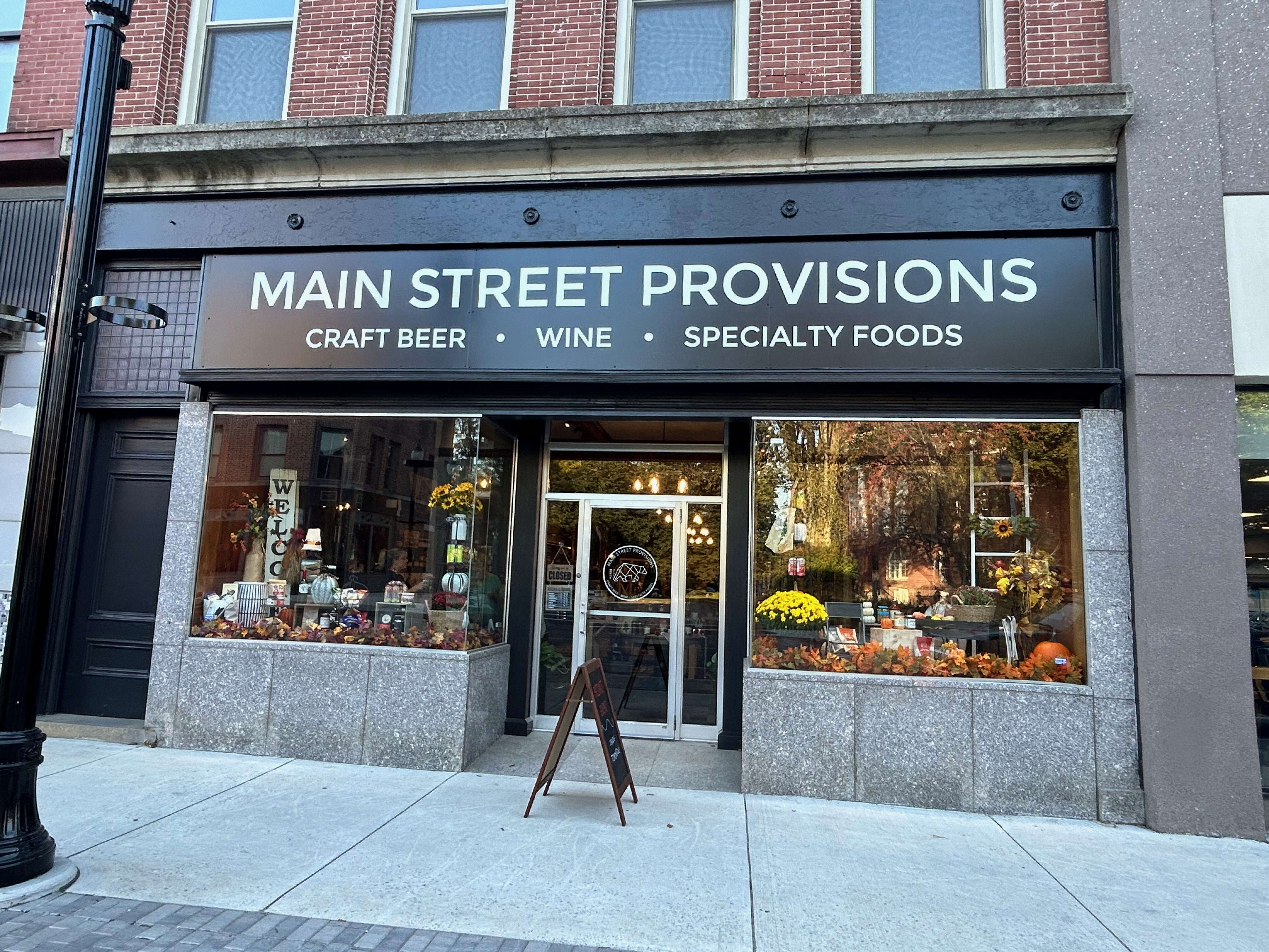 store front and sidewalk with signs