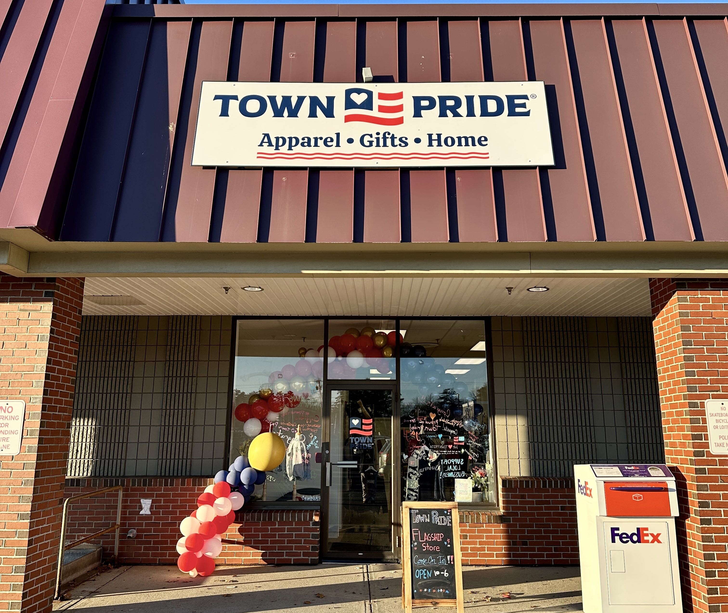 storefront with sign and balloons