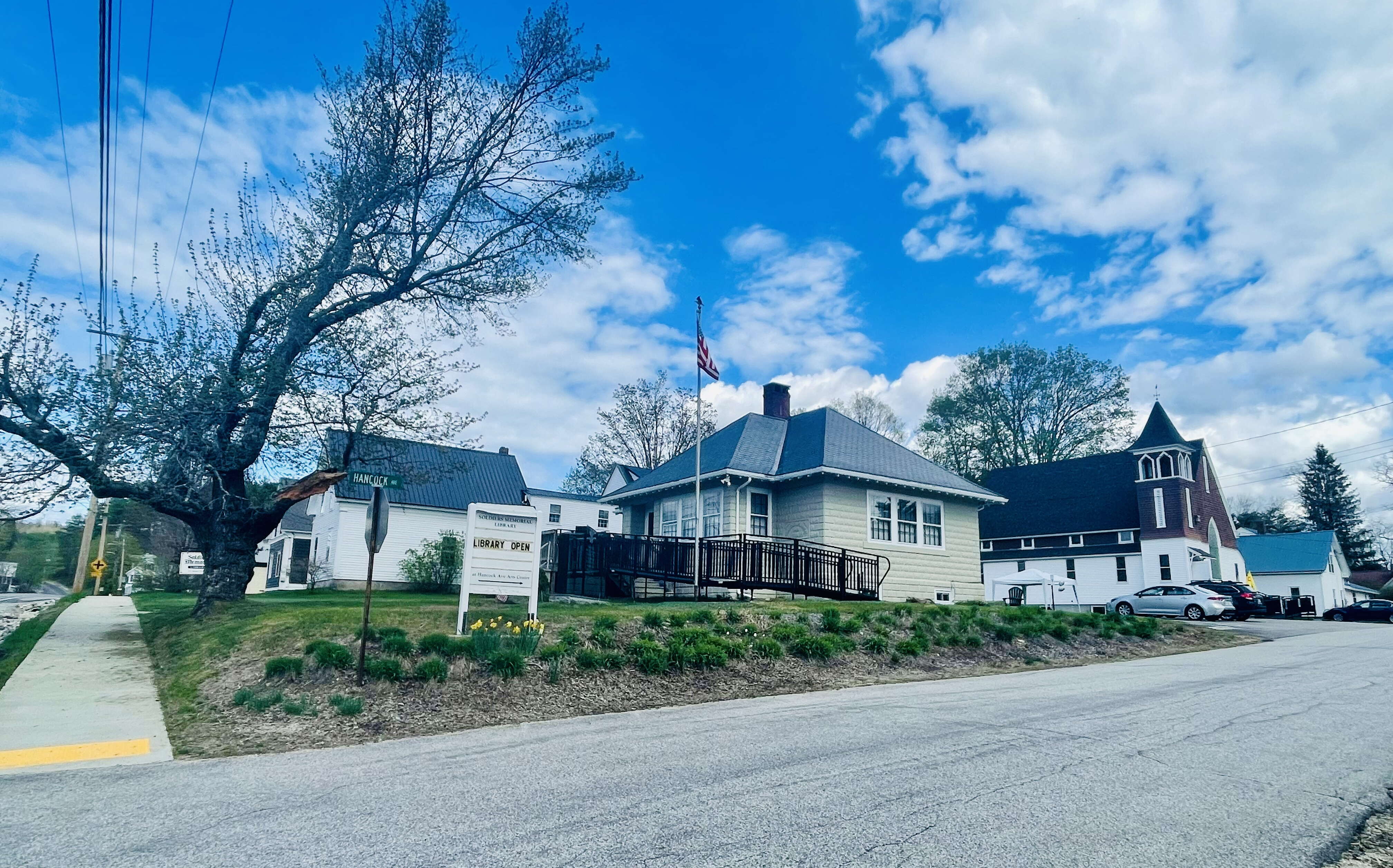 The town of Hiram's library is in the front building, with a former church located to the rear.