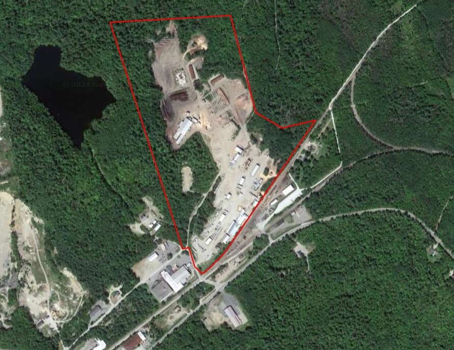 The former Robbins Lumber mill site is seen from the air with a red line delineating the boundary.