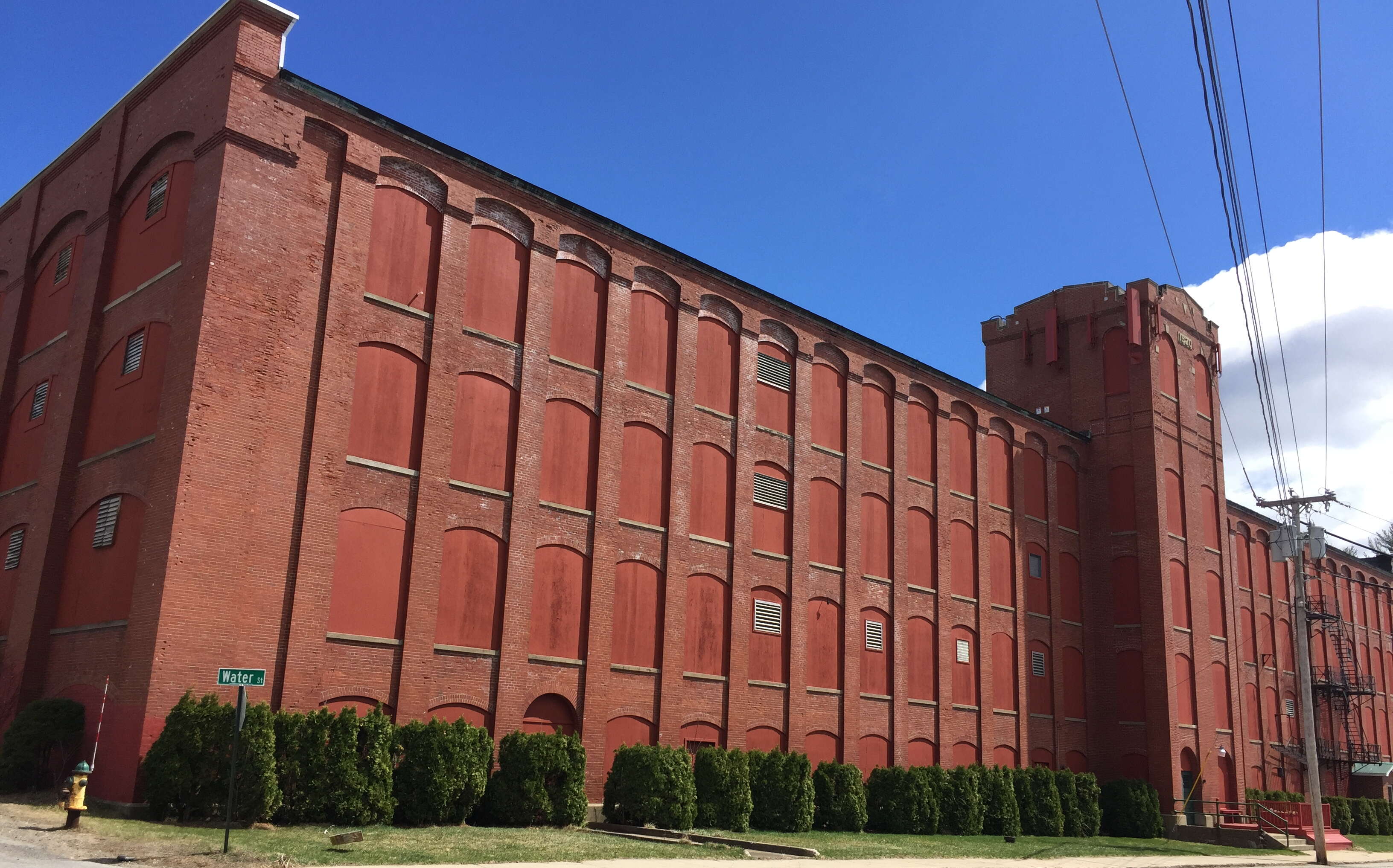 A four-story red brick building.