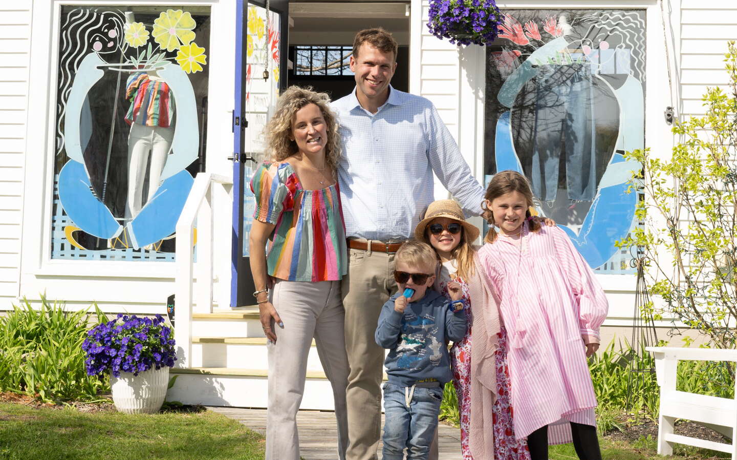 The family that bought 25 Bow St. in Freeport stands outside the store