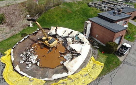 An aerial view shows work underway on a round footprint.
