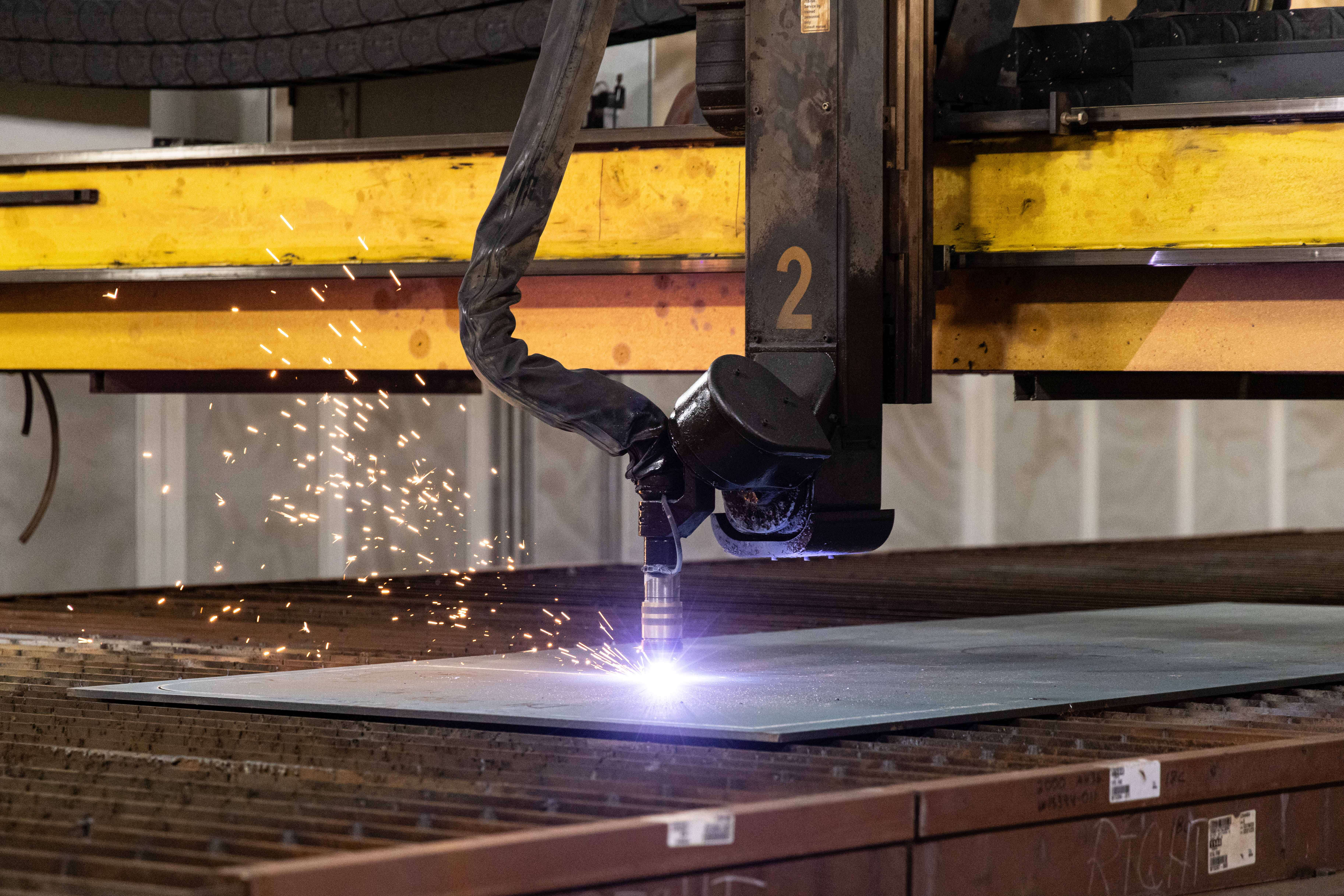 A burning machine cuts through steel at BIW.