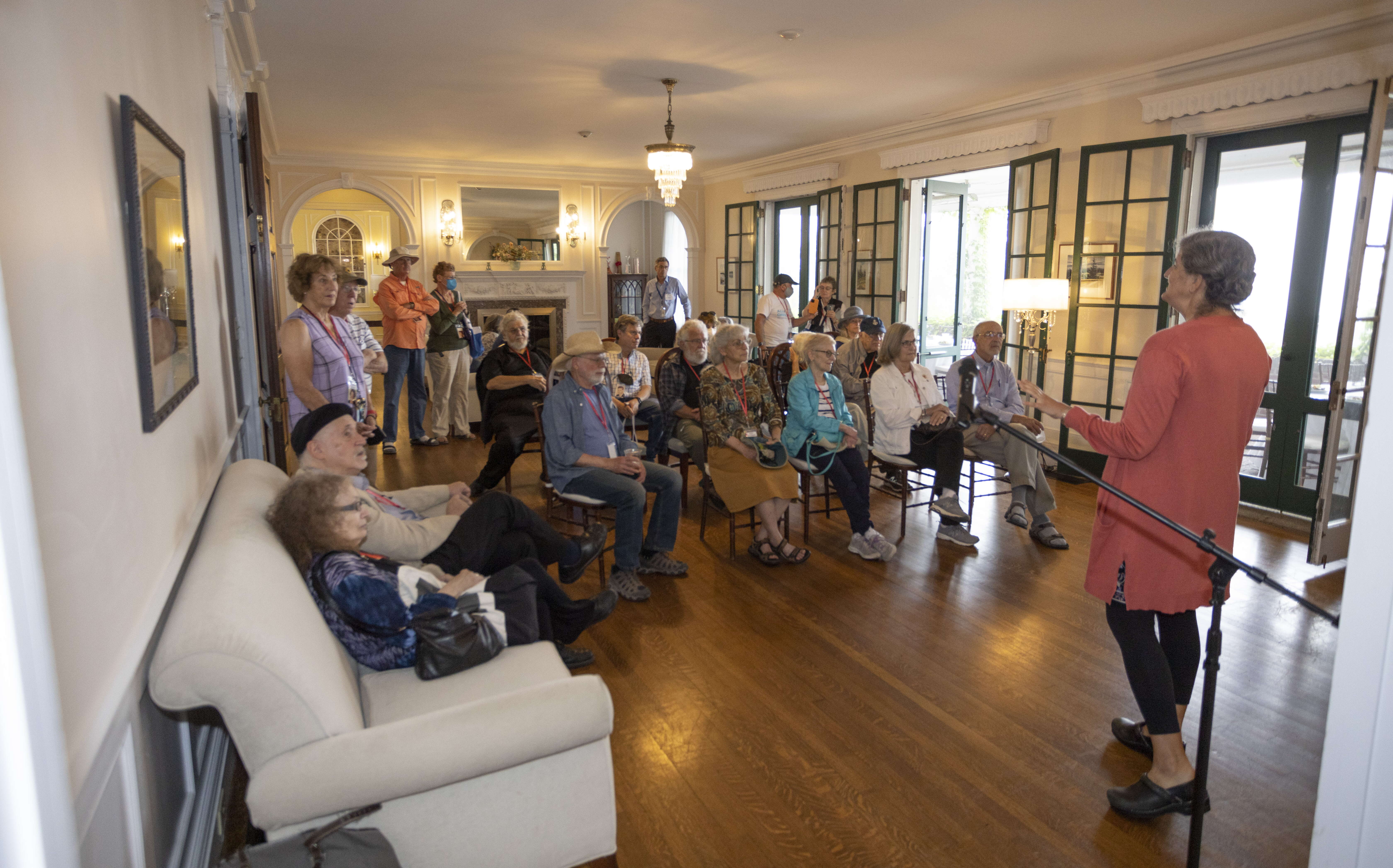 A group of people sit in a nice room at HighSeas.