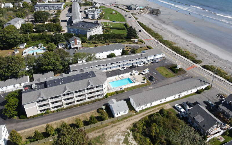 An aerial view of hotels by the beach.