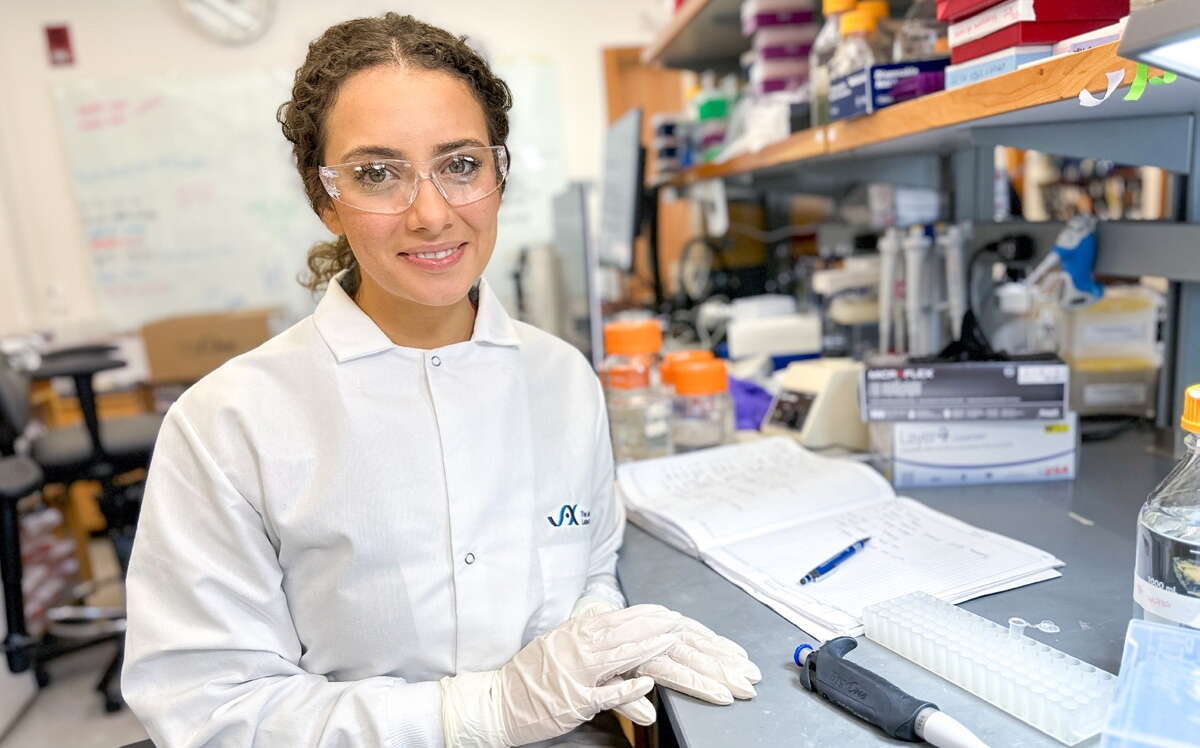 A person site at a lab work table.