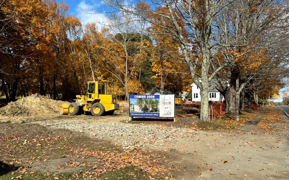 A construction site with a sign.