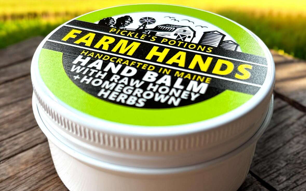 A round container labeled hand balm.