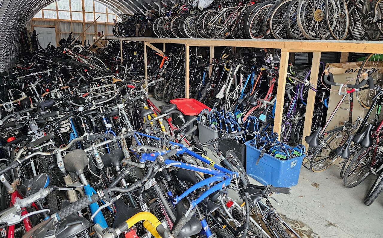 A Qunoset hut is full of bikes.