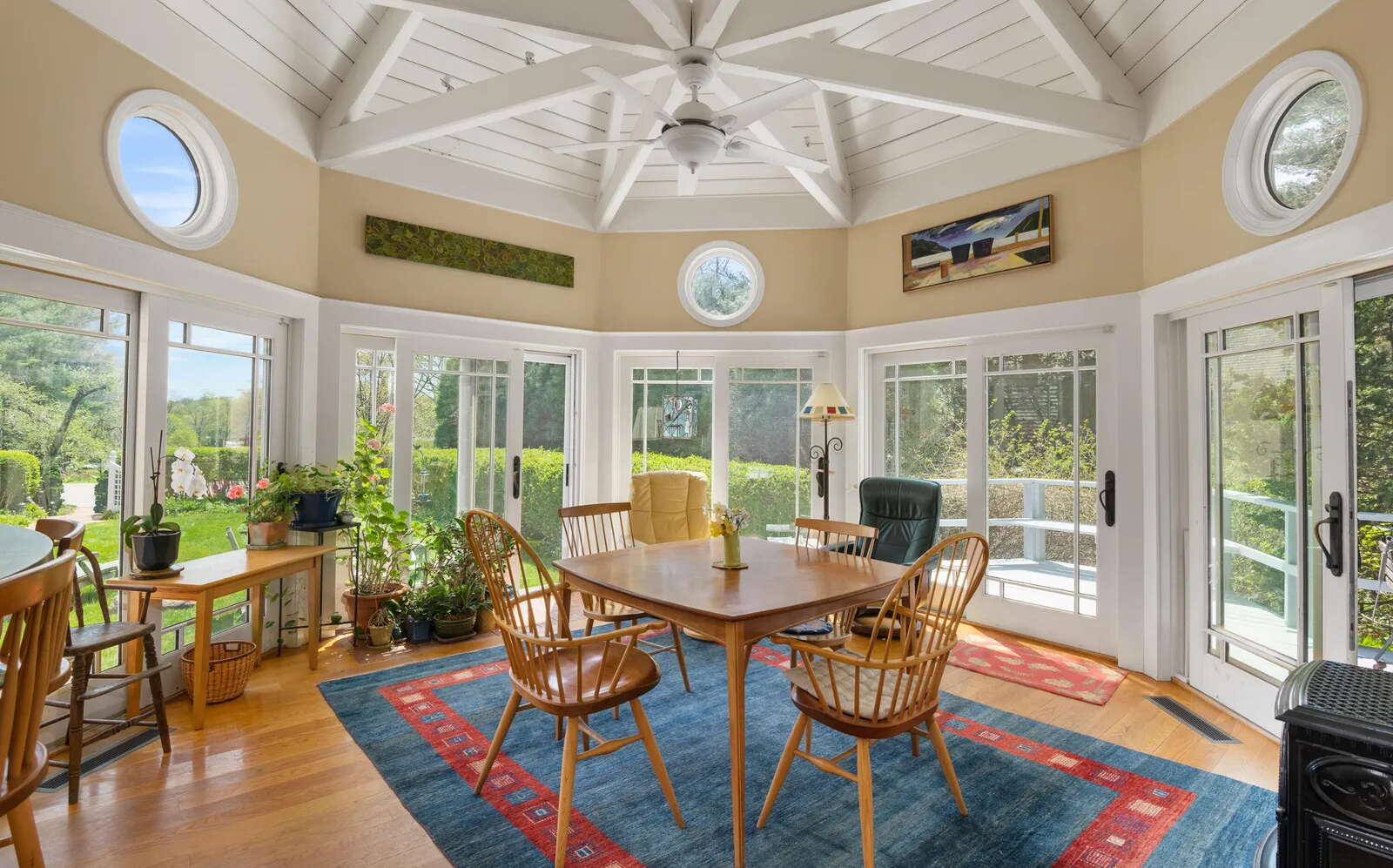 An octagonal room has lots of windows.