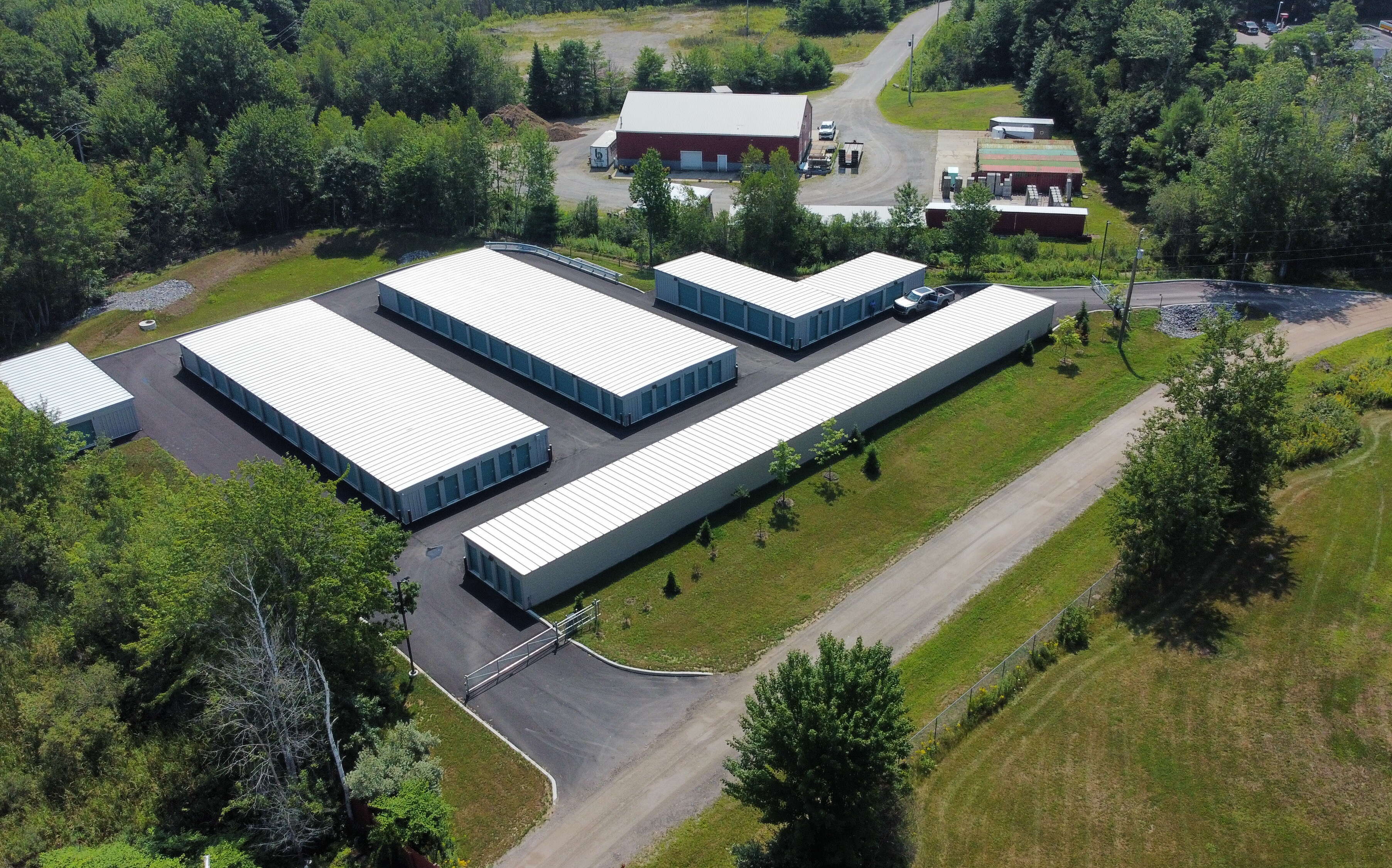 An aerial view of long, low buildings.