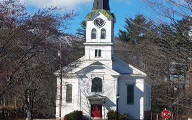 A church is surrounded by trees.