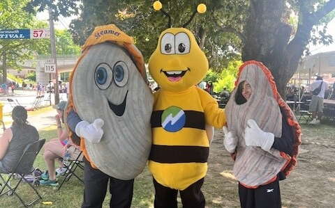 Three mascots under a tree at the Yarmouth Clam Festival