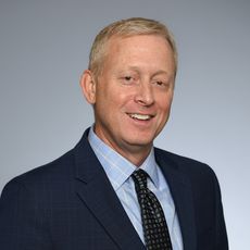 Doug McKeown, CEO of Woodard & Curran, in a suit (portrait shot)