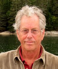 person by the water with glasses