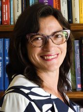 person's headshot with books