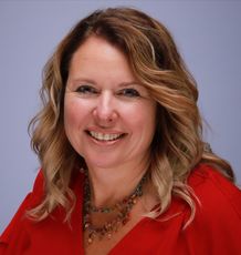 smiling person in red blouse