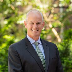 person in suit and tie smiling