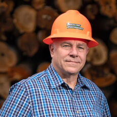 person in plaid shirt and hardhat