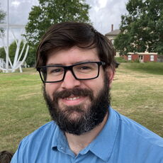 The founder of Bath at Play stands in a park.