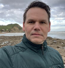 CEI's Hugh Cowperthwaite takes a selfie on a beach.