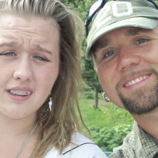 This closeup photo shows the owner of Kennebec Roofing with his daughter.