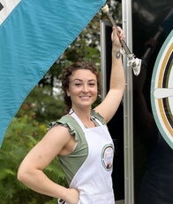 Hailee Carter holds a flagpole.