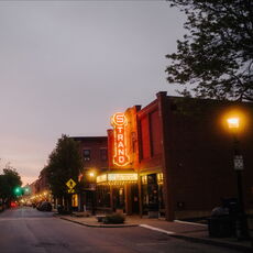 Strand Theatre exterior at night.