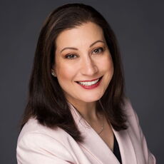 A person poses for a headshot.