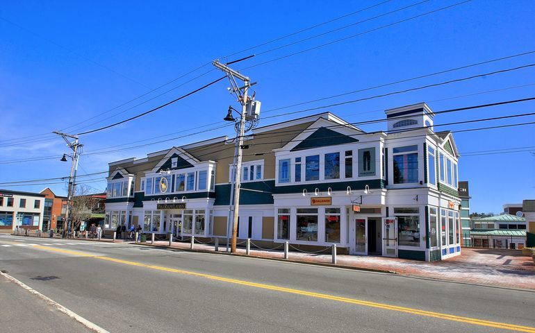 retail building and street and telephone lines