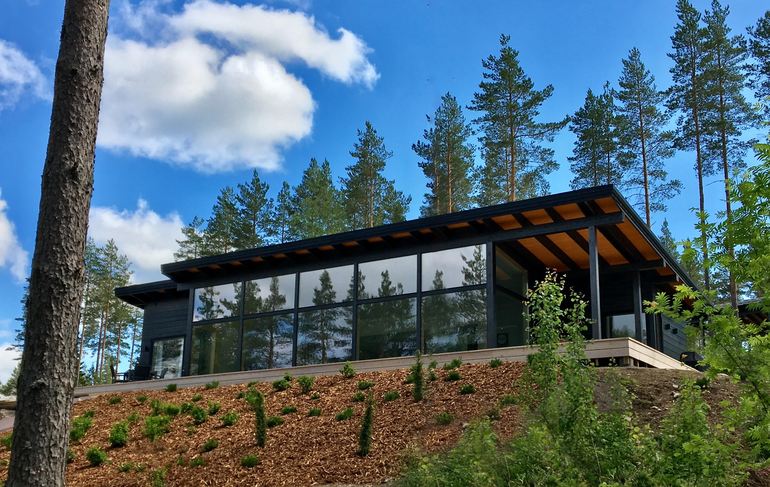 house on hill with big windows