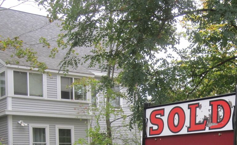 partial house tree sold sign