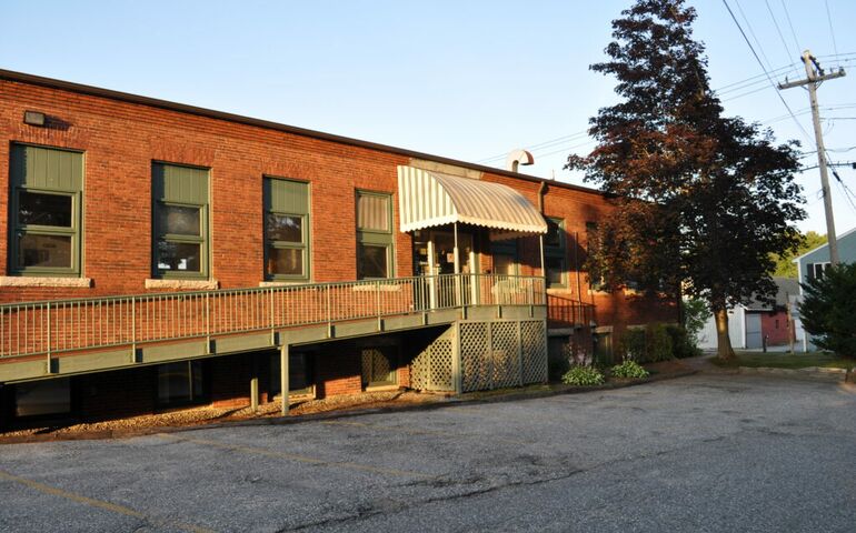 side of brick building and pavement