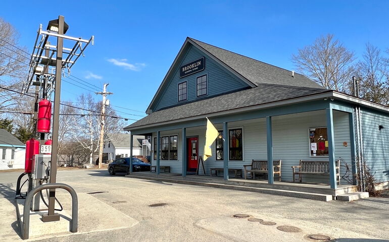 building, gas pumps, pavement