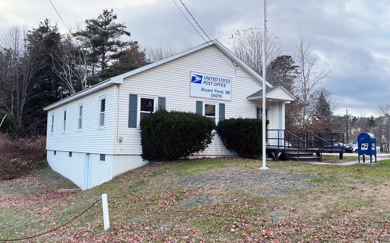 exterior of small building with sign