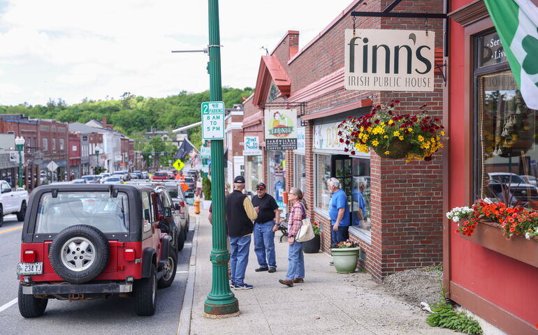 A scene in downtown Ellsworth shows folks shopping and stores and restaurants.
