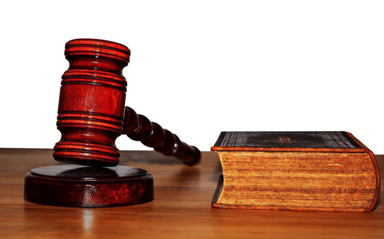 Gavel and bible in a courtroom, for a story about PPP fraud.