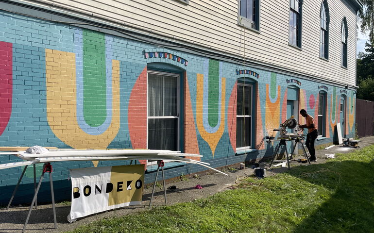 A person works with machinery at Mayo Street Arts.