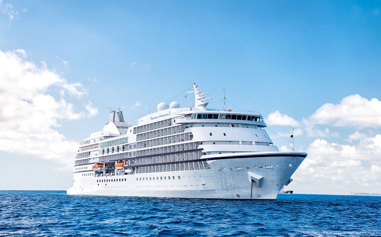 A large cruise ship sails the ocean.