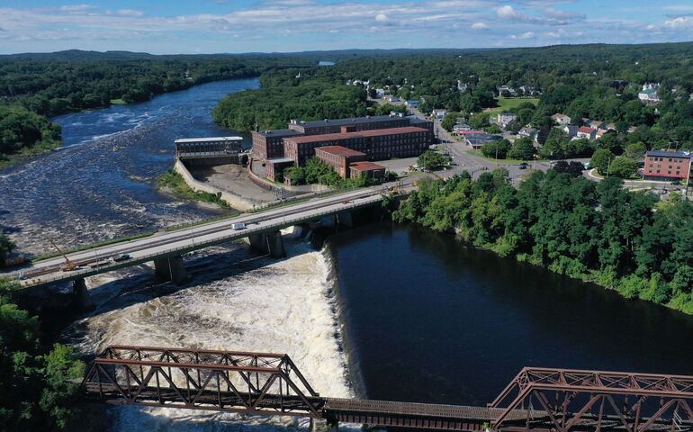 An aerial view shows a large brick building called the Hathaway Center.