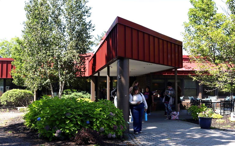 A building entry with students.